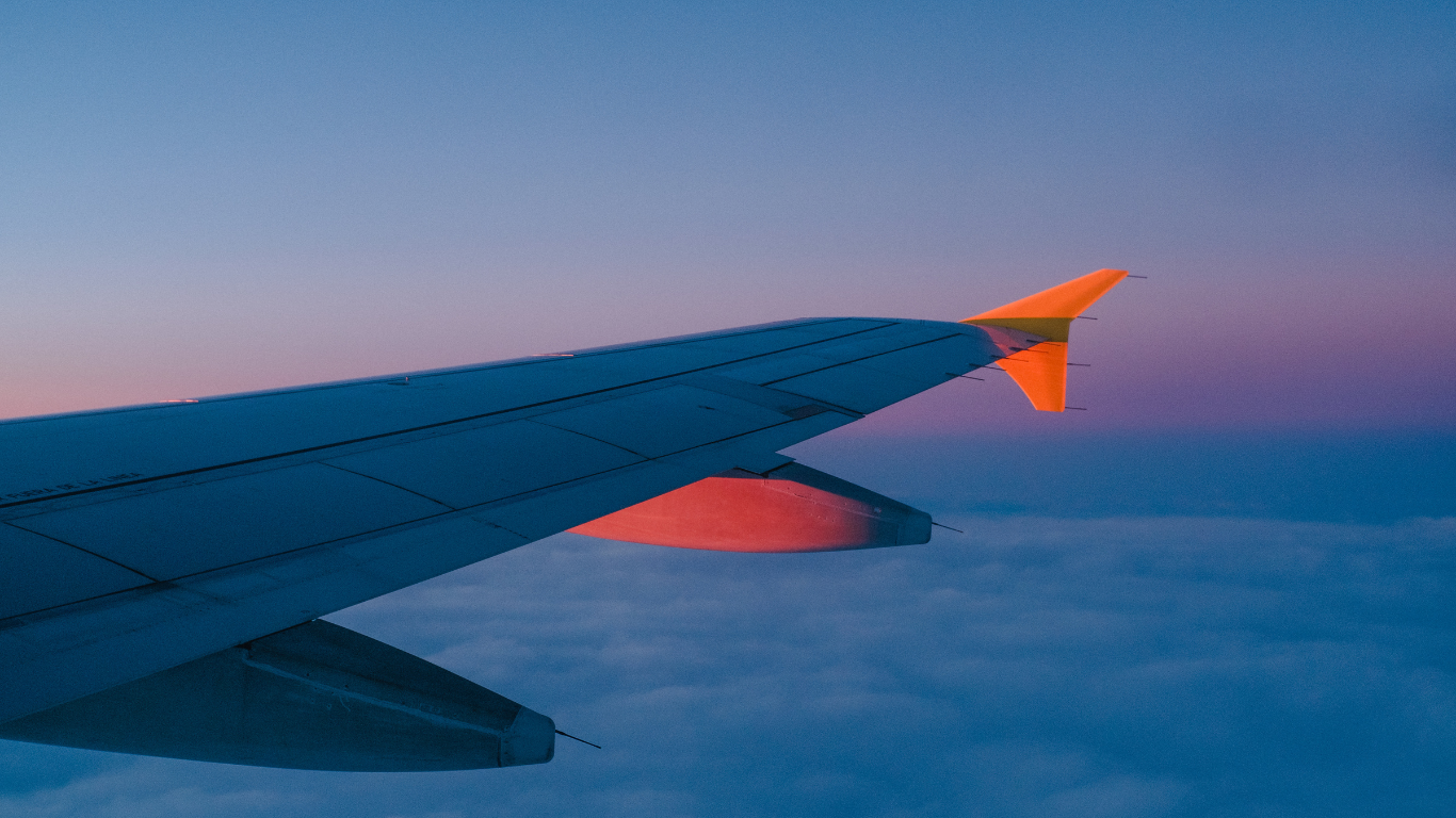 Airplane flying through the sky